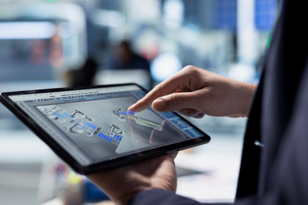 Factory expert monitoring machinery